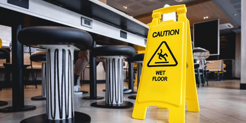 Caution wet floor sign to prevent accident at food and beverage business